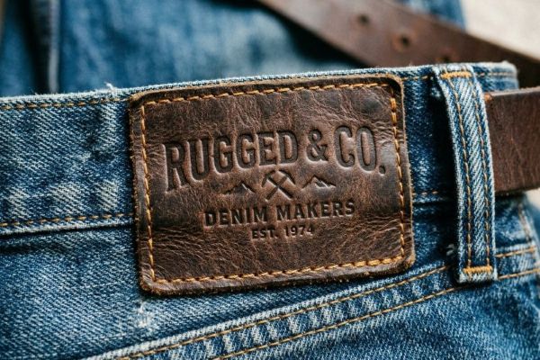 Close-up debossed leather patch on jeans waistband
